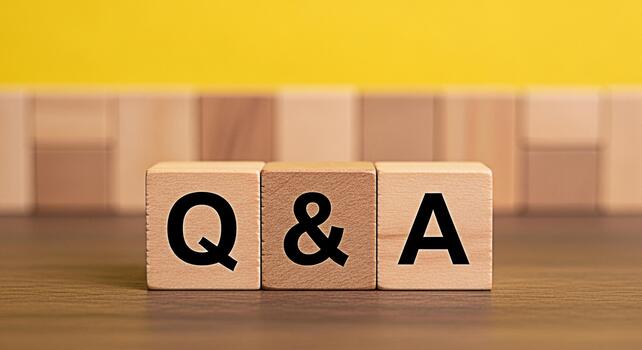 Wooden blocks displaying Q A on a wooden surface against a yellow background symbolizing knowledge learning and the importance of asking questions for understanding and problemsolving in education and photo