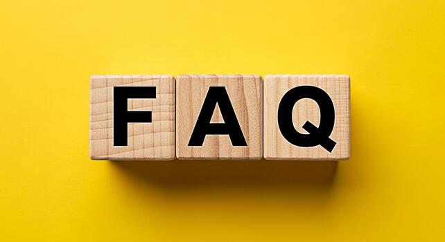 Wooden blocks spelling FAQ on a vibrant yellow background representing frequently asked questions and providing clarity and support creating a sense of helpfulness and information access photo