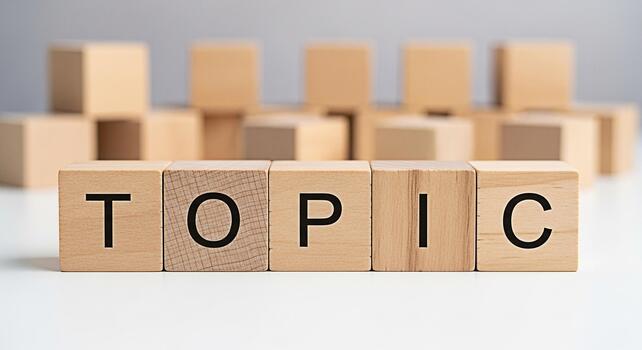 Wooden blocks spelling out TOPIC on a white surface representing a key subject matter suggesting focus and relevance in a learning or discussion environment conveying clarity and importance photo