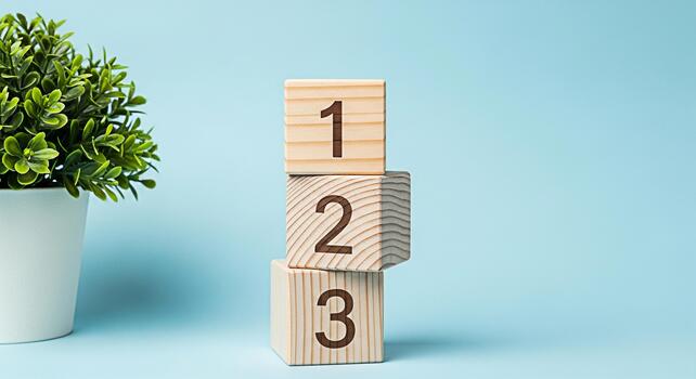 Wooden number blocks stacked in a studio setting showcasing the concept of learning and development with a minimalist aesthetic and a plant symbolizing growth and education in a bright cheerful enviro photo