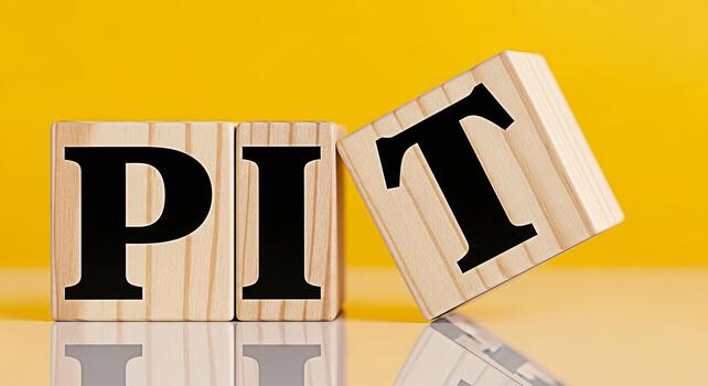 Wooden blocks spelling PIT on a bright yellow surface symbolizing challenges and obstacles in business and life creating a sense of adversity and the need for problemsolving strategies photo