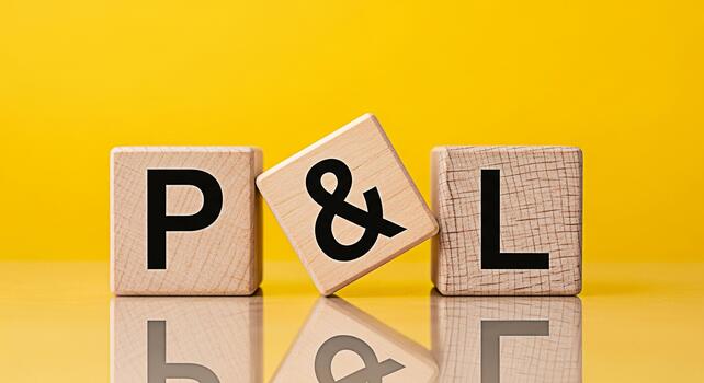 Wooden blocks displaying P L on a bright yellow background representing profit and loss in a simple and visually engaging way ideal for financial concepts and business presentations photo