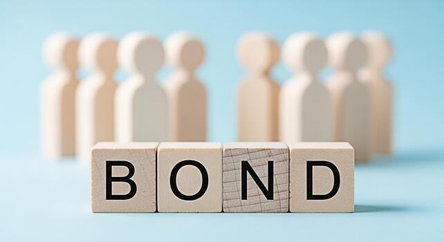 Wooden figures standing behind the word BOND spelled out with wooden blocks on a light blue background representing connection unity and strong relationships in a collaborative environment photo