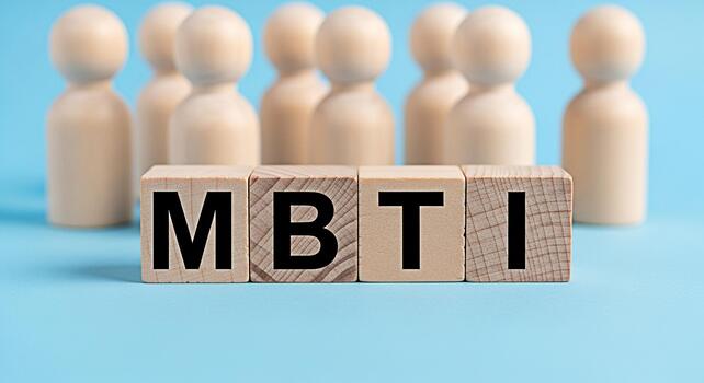 Wooden figures standing behind wooden blocks spelling MBTI on a blue background representing personality assessment and psychological types creating a concept of selfawareness and understanding photo