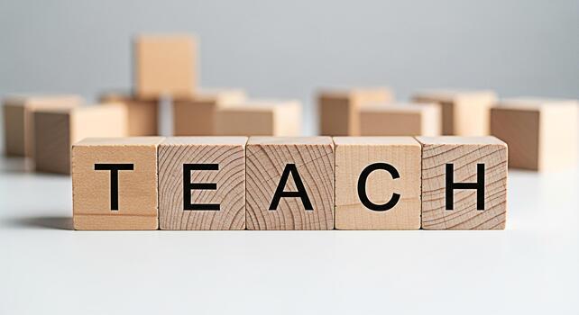 Wooden blocks spelling TEACH on a white surface symbolizing education and learning in a minimalist setting conveying a message of knowledge and guidance for students and educators alike photo