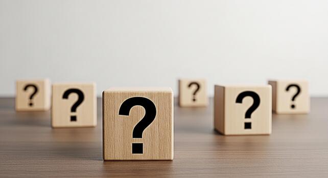 Wooden cubes displaying question marks on a wooden table symbolizing uncertainty and the search for answers in a minimalist and thoughtprovoking setting perfect for educational or business concepts photo