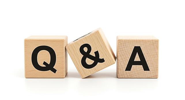Wooden blocks displaying QA on a white surface representing questions and answers in a simple and clear manner ideal for educational content or customer support materials photo