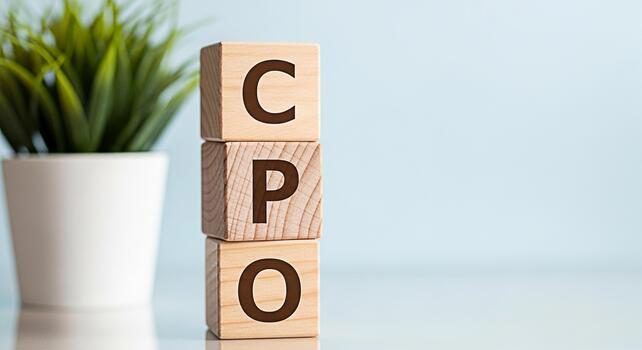 Wooden blocks displaying CPO on a reflective surface in a bright studio setting symbolizing cost per order marketing strategy and optimization for business growth and success photo