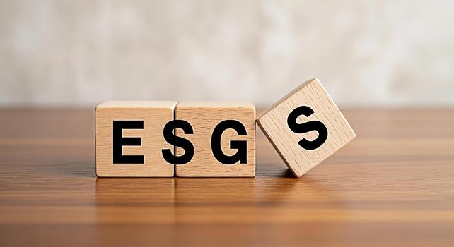 Wooden blocks displaying ESG factors on a wooden table representing sustainable investing and corporate responsibility in a bright modern setting conveying a message of ethical and responsible busines photo