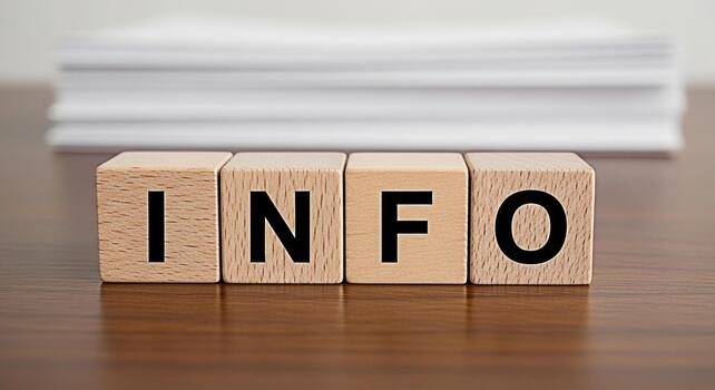 Wooden blocks spelling INFO on a wooden table conveying a message of information and knowledge perfect for educational or business contexts creating a clear and concise visual representation photo