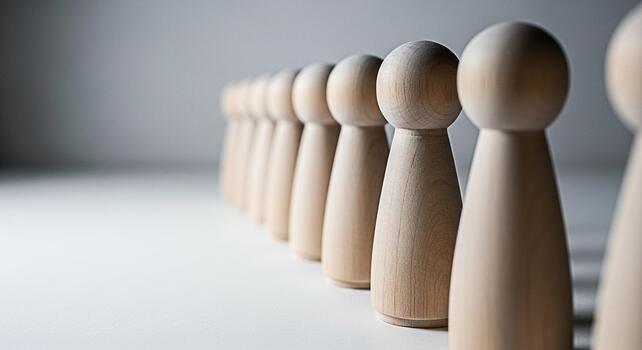 alineado de madera cifras en pie en un fila en un blanco superficie simbolizando unidad trabajo en equipo y el importancia de cada individual en lograr un común objetivo con un minimalista y limpiar estético foto