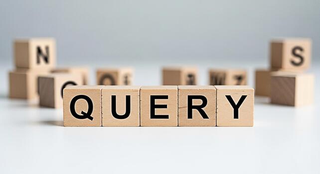 Wooden blocks spelling QUERY on a white surface surrounded by other lettered blocks representing information retrieval and search engine optimization in a clean minimalist setting photo