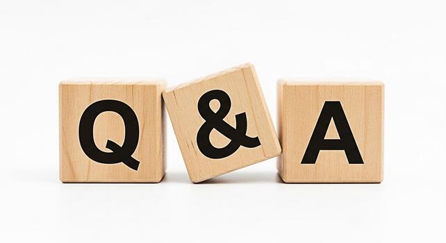 Wooden blocks displaying QA on a white surface representing questions and answers in a simple and clean environment symbolizing knowledge and information exchange photo