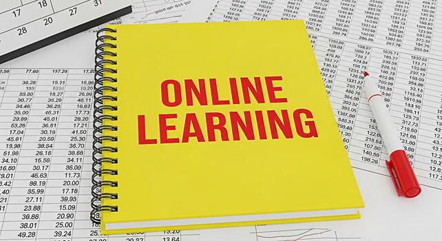 Bright yellow notebook displaying Online Learning on a financial spreadsheet with a red marker symbolizing accessible education and the integration of technology in modern financial education photo