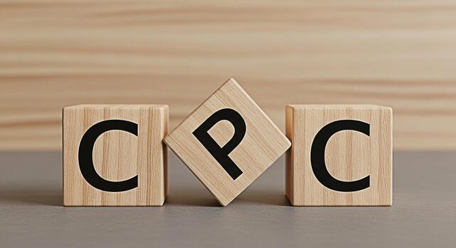Wooden blocks displaying CPC on a neutral surface symbolizing cost per click advertising strategy in a conceptual and minimalist setting conveying a message of digital marketing and online business gr photo