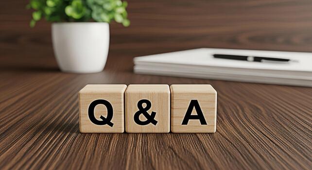Wooden blocks displaying Q A on a wooden desk in a bright office environment representing knowledge sharing and information exchange in a professional and informative setting photo