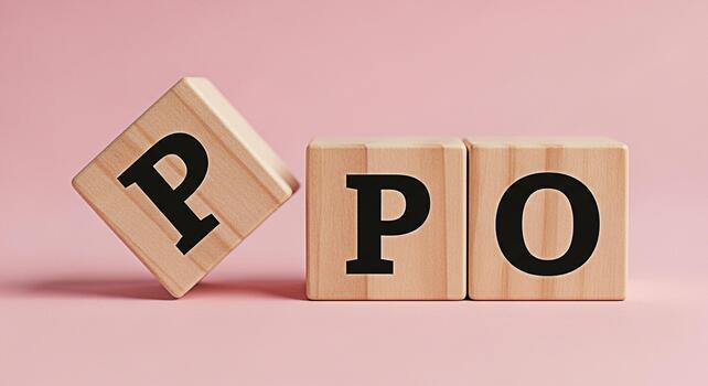 Wooden blocks displaying the letters PPO on a pink background representing Preferred Provider Organization symbolizing healthcare choices and insurance options in a simple and minimalist setting photo