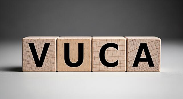 Wooden blocks spelling VUCA on a white surface representing Volatility Uncertainty Complexity and Ambiguity in a business environment symbolizing challenges and strategic planning for future success photo