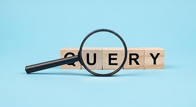 Magnifying glass inspecting wooden blocks spelling QUERY on a light blue background representing investigation search and information retrieval with a clean and minimalist aesthetic photo