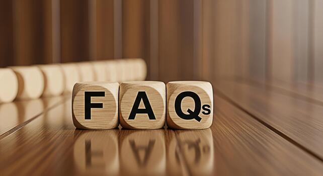 Wooden blocks displaying FAQ on a wooden surface representing frequently asked questions and information access in a warm inviting environment promoting clarity and understanding photo