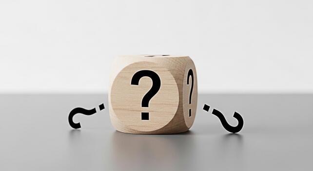 Wooden dice displaying question marks on a neutral surface symbolizing uncertainty and the need for problemsolving in a clean minimalist environment evoking curiosity and the search for answers photo