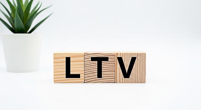 Wooden blocks spelling LTV on a white surface symbolizing Lifetime Value in a clean and minimalist setting representing business strategy and financial planning with a modern and professional aestheti photo