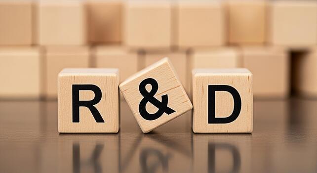 Wooden blocks displaying RD on a reflective surface symbolizing research and development in a corporate setting conveying innovation and strategic planning for business growth and technological advanc photo