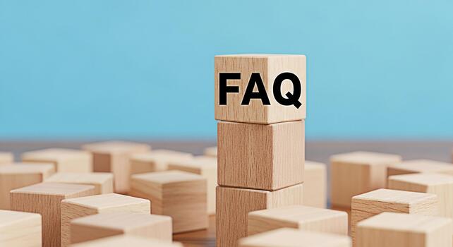 Wooden blocks displaying FAQ in a bright minimalist studio setting symbolizing readily available information and customer support creating a sense of clarity and accessibility for frequently asked que photo