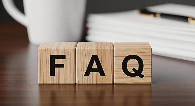 Wooden blocks spelling FAQ on a desk in a bright office representing frequently asked questions and knowledge base promoting clarity and customer support in a professional environment photo
