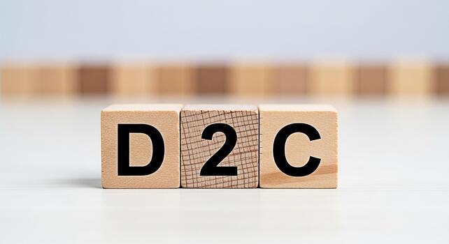 Wooden blocks displaying D2C on a white surface representing directtoconsumer business model emphasizing simplicity and clarity in a minimalist setting conveying a modern and straightforward approach photo
