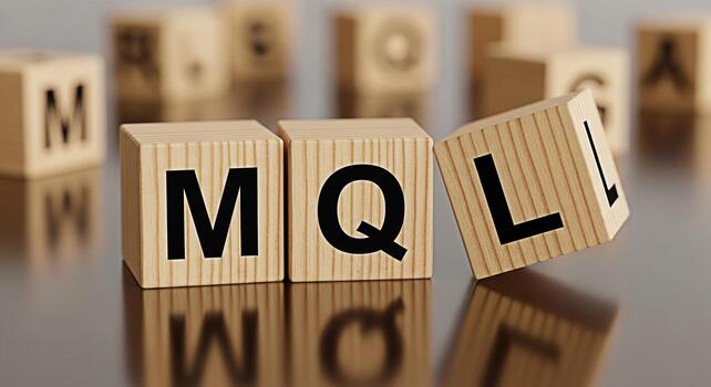 Wooden blocks spelling MQL on a reflective surface representing a programming language in a studio setting conveying a sense of learning and technology ideal for educational or technical content photo