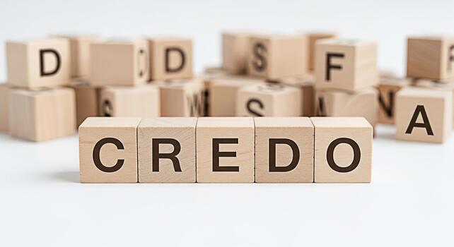 Wooden blocks spelling CREDO on a white surface representing beliefs and principles conveying a sense of conviction and commitment in a minimalist setting ideal for business and ethical concepts photo