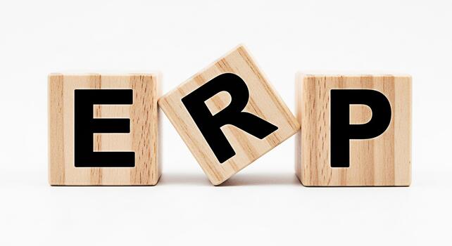 Wooden blocks spelling ERP on a white surface showcasing enterprise resource planning representing business management and integrated applications for a streamlined and efficient workflow in a modern photo