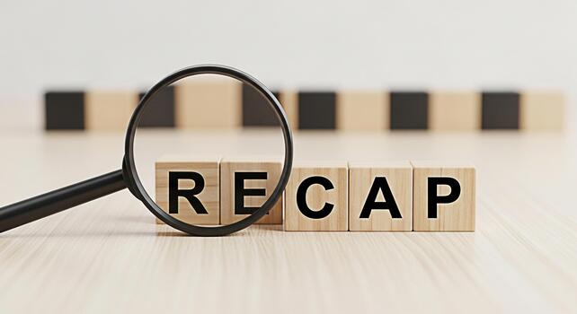Magnifying glass focusing on wooden blocks spelling RECAP on a bright wooden surface symbolizing review and summary with a clear concise and analytical approach to information processing photo