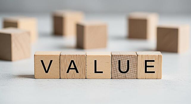 Wooden blocks spelling VALUE on a white surface representing core principles and ethical standards in a business environment conveying trust integrity and longterm success photo