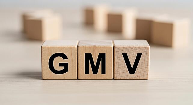 Wooden blocks displaying GMV on a bright wooden surface representing Gross Merchandise Value a key performance indicator in ecommerce conveying a sense of financial success and business growth photo