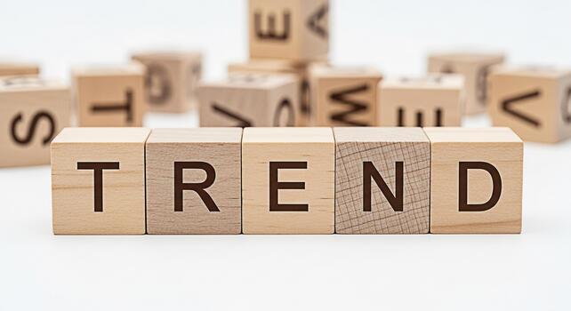Wooden blocks spelling TREND on a white surface representing the concept of emerging styles and popular topics in a clean and minimalist setting evoking a sense of modern awareness and forwardthinking photo
