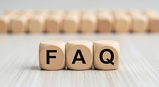 Wooden blocks displaying FAQ on a bright wooden surface representing frequently asked questions and providing answers creating a helpful and informative atmosphere for customer support and online assi photo