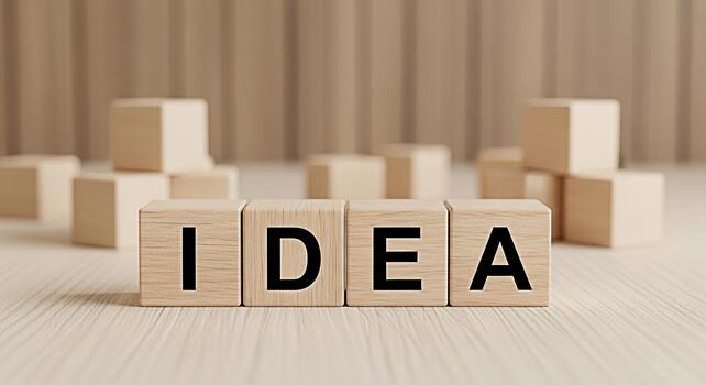 Wooden blocks spelling IDEA on a bright wooden surface representing creative thinking and innovation in a minimalist and inspiring setting symbolizing new concepts and solutions for business and perso photo