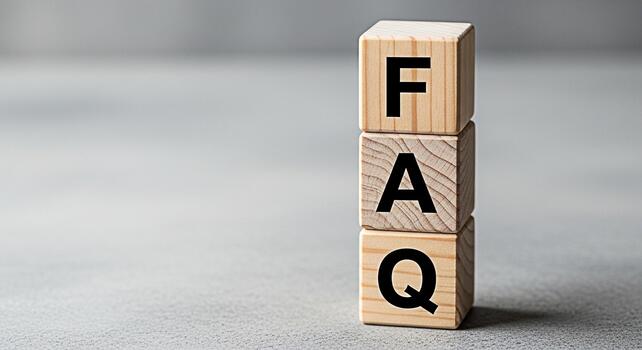 Wooden blocks spelling FAQ stacked on a gray surface representing frequently asked questions providing information and support creating a clear and helpful resource for users and customers photo