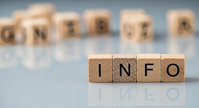 Wooden blocks spelling INFO on a reflective surface conveying a sense of clarity and accessibility in a modern minimalist setting ideal for educational or informational content promoting transparency photo