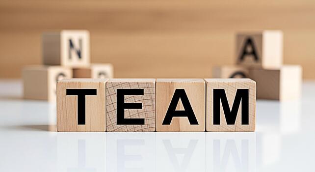 de madera bloques ortografía equipo en un blanco superficie simbolizando colaboración y unidad en un corporativo ambiente Fomentando un sentido de trabajo en equipo y compartido éxito promoviendo un positivo y cooperativa atmo foto