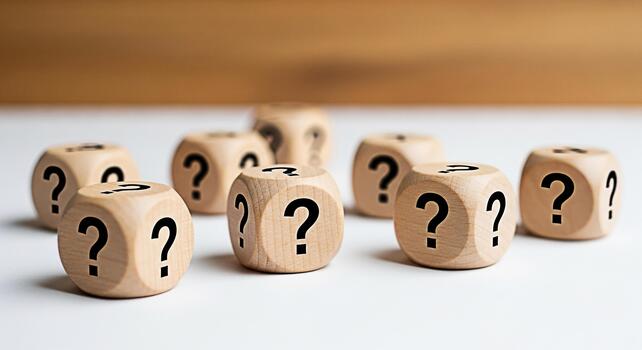 Wooden dice displaying question marks scattered on a white surface creating a sense of uncertainty and curiosity about the unknown inviting exploration and problemsolving in a bright studio setting photo