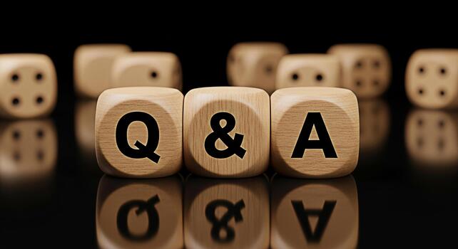 Wooden dice spelling out Q A sitting on a reflective black surface representing questions and answers knowledge and the importance of information in a clear and concise manner photo