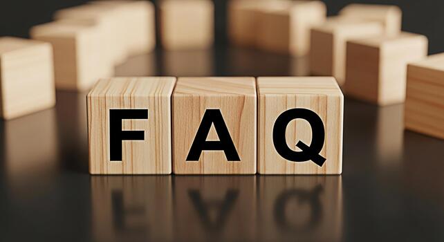 Wooden blocks displaying FAQ on a reflective surface representing frequently asked questions and information creating a clear and concise message in a professional and informative setting photo