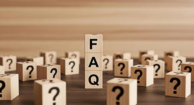 Wooden blocks spelling FAQ standing tall amidst question mark blocks on a dark wooden surface creating a sense of clarity and guidance in a confusing landscape symbolizing answers and solutions photo