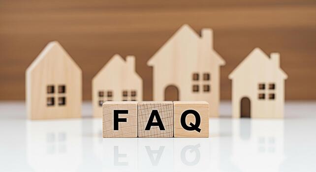 Wooden house models display FAQ on wooden blocks in a bright minimalist setting representing common real estate queries and offering a sense of clarity and guidance for potential homeowners photo