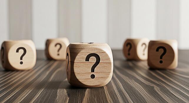 Wooden dice displaying question marks on a dark wooden table symbolizing uncertainty and the need for answers in a challenging and inquisitive environment creating a sense of mystery and anticipation photo