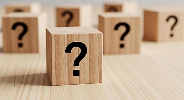 Wooden blocks displaying question marks on a bright wooden surface symbolizing uncertainty and the need for answers in a clear and concise manner evoking a sense of curiosity and problemsolving photo