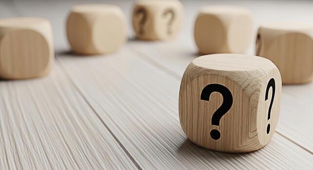 Wooden dice displaying question marks on a wooden surface representing uncertainty and the need for answers in business personal life and decisionmaking processes creating a sense of mystery and intri photo